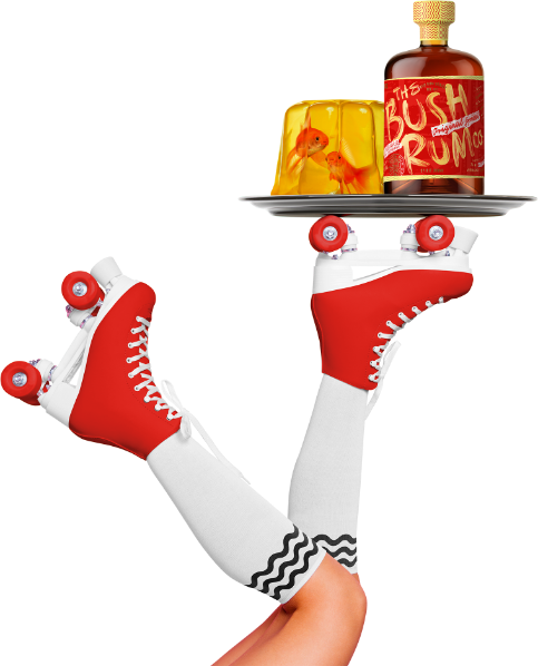 Upside down legs with roller skates holding bush rum on a tray